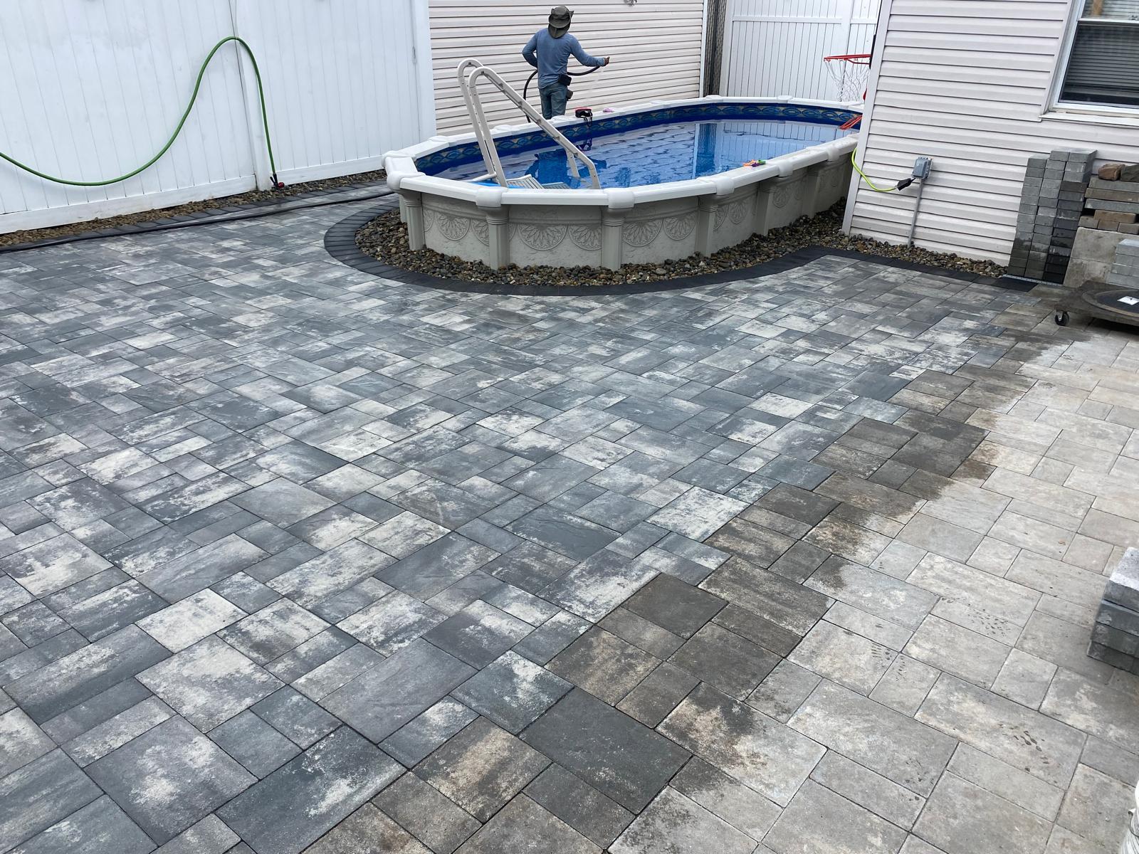 Backyard paver surface during final cleanup