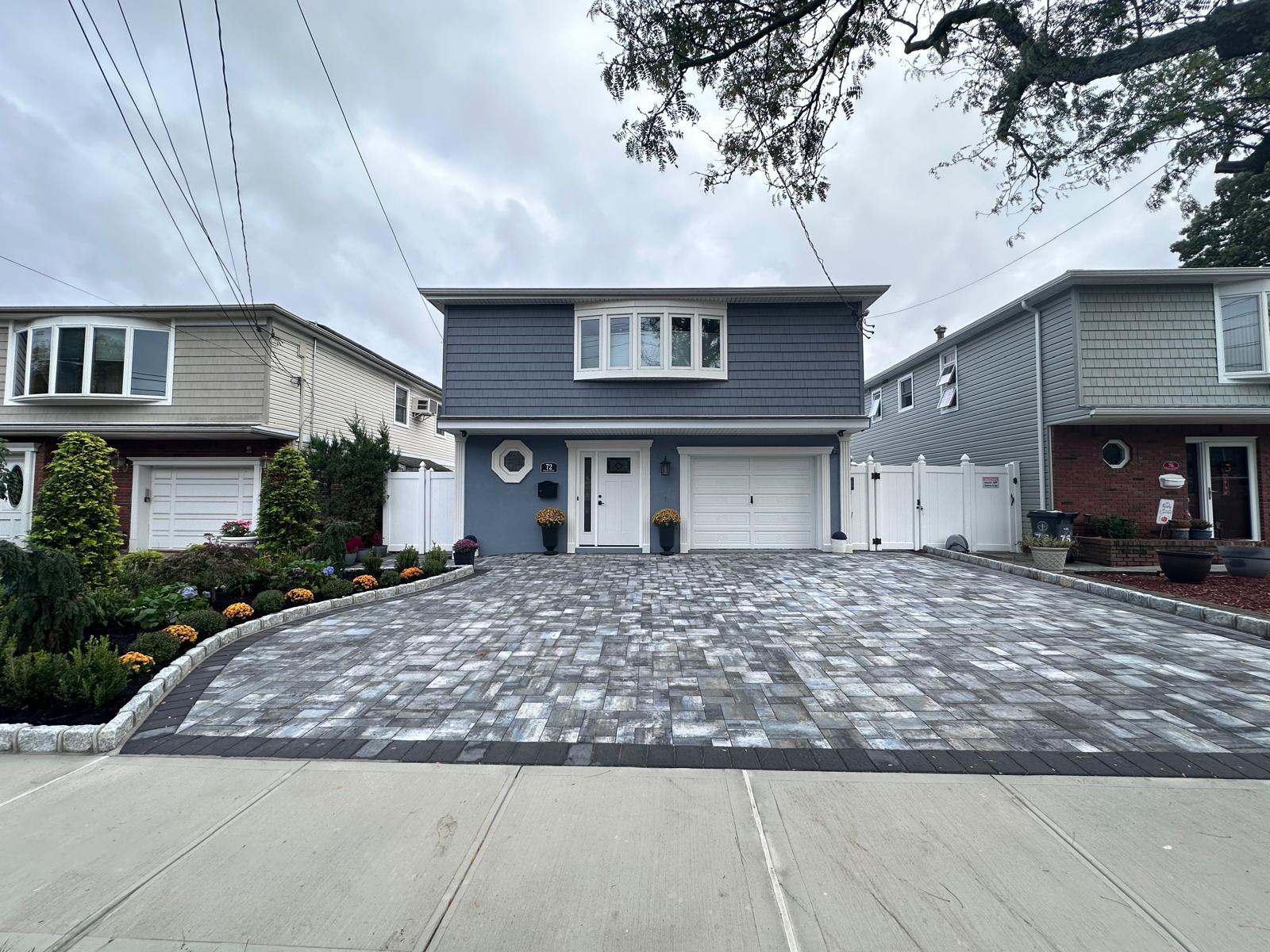 Completed paver driveway and front walkway by ERY Construction